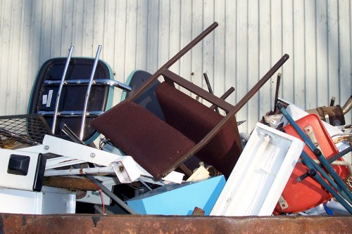 Construction workers clearing builders waste in Stratford site
